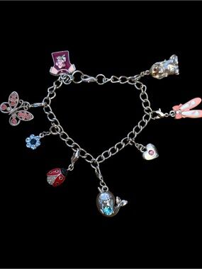 Silver tone assorted charm bracelet
